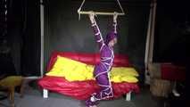 Watching sexy Sonja wearing a supersexy purple shiny nylon rainwear combination being tied and gagged overhead with ropes and a clothgag (Video)