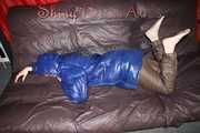 Sexy Sonja changing clothes to a brown down pants and a blue down jacket and lolling on the sofa (Pics)