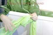 MARA ties and gagges herself in a bath tub cuffs and a cloth gag wearing a super sexy super shiny green rubber rainsuit (Pics)