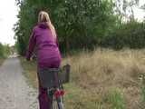 Get a Video with Sandra riding her bike enjoying her shiny nylon Rainwear