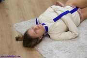 Hogtied in a straithjacket and barfeet