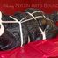 Lucy tied, gagged and hooded on a sofa wearing a sexy black rain pants and rain jacket (Pics)