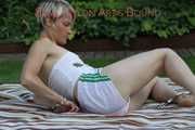 Watching Sonja wearing a hot white shiny nylon shorts and a white top bound herself and gag herself in the garden (Pics)