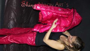 Watching sexy Sandra wearing a sexy pink shiny nylon rain pants and a pink down jacket nestle down in a down cover (Pics)