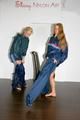 Sabrina and Katharina dressing themselves with shiny nylon AGU rainwear (Pics)