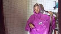 Watching Sandra wearing only a pink shiny nylon raincape under the shower playing with the water (Video)