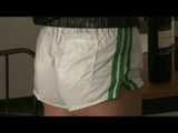 SEXY ENNI wearing a hot white shiny nylon shorts and a black shiny nylon rain jacket during her clock-off (Video)