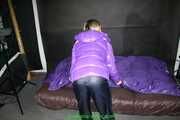 Watch Maly enjoying her shiny nylon Downjacket in her shiny nylon Bed