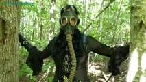in the forest with a dress and a gas mask