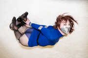 Kitty Quinzell in blue dress and silver tape