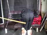 Watch Sandra beeing bound, gagged and spanked in her shiny nylon Rainsuit