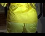 Lucy wearing a supersexy yellow shiny nylon shorts and a yellow rain jacket during her workout on the hometrainer (Video)