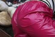 Watching Aiyana wearing supersexy pink shiny nylon rainwear while planting flowers in the garden (Pics)