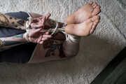 Proserpine in Shorts and barefoot Hogtie