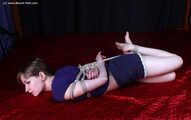 Agnes hogtied on bed