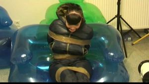 0235 min video with Jill tied and gagged in shiny down suit