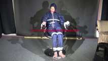 Watching Sonja sitting on a hairdresser`s chair wearing sexy blue shiny nylon rainwear with a raincape being tied, gagged and hooded with ropes and a clothgag (Video)