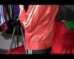 SONJA wearing a sexy black shiny nylon rain pants and an oldschool red rain jacket sorting shiny nylon shorts (Video)