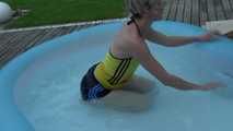 Watching sexy Sonja enjoying the water in the pool and the feeling of shiny nylon on her skin wearing a sexy shiny nylon shorts and a top (Video)