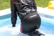 Watching sexy Mara going into the swimming pool wearing a sexy black/pink rainwear combination (Pics)