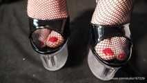 Fishnet tights and red fingernails