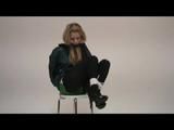 Samantha tied and gagged on a chair with green shiny nylon shorts and a green rain jacket (Video)