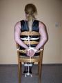 Chairtied in a black dress