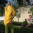 Watch Chloe enjoying the warm Sun in her yellow shiny nylon Rainsuit 