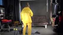 Watching sexy SANDRA vacuum cleaning the studio wearing a sexy yellow rainwear combination (Video)