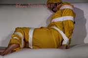 Watching Pia being tied and gagged with tape and a cloth gag wearing sexy yellow shiny nylon rainwear (Pics)