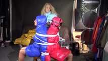 Watching sexy Stella and Sandra being tied and gagged ba Sophie on a stool with ropes and ballgags wearing sexy shiny nylon rainwear and downwear (Video)