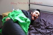 Jill tied, gagged and hooded wearing shiny nylon rainwear and a raincape over it (Pics)