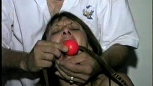 48 YR OLD WAITRESS, BALL, RING-GAGGED & COTTON BALLS STUFFED IN HER MOUTH (D20-10)
