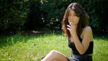 Arina is smoking 120mm cigarettes outdoors