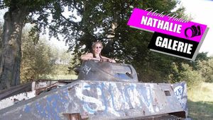 Nathalie poses on a Hotchkiss armored personnel carrier