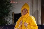 Sonja wearing a sexy blue shiny nylon shorts and a yellow rain jacket preparing her bed (Pics)