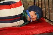 Mara tied, gagged and hooded on a princess bed wearing sexy oldschool downwear in blue/red/white (Pics)