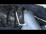 03:10 Min. video with Nina tied and gagged in a shiny nylon down jacket and shiny nylon rainpants