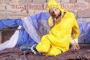 Alina tied, gagged and hooded on a princess bed in an old cellar wearing a shiny yellow rain combination (Pics)