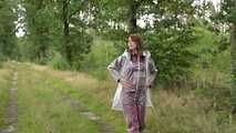 Miss Petra takes a walk in an AGU rain suit, transparent rainsuit and rubber boots (looped version)