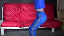 Sexy Sonja being tied and gagged overhead with ropes wearing a sexy blue shiny nylon pants and a jacket (Video)