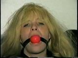 SEXY BOMBSHELL TRACY BALL-GAGS HERSELF, IS MOUTH STUFFED & HANDGAGED (D38-10)