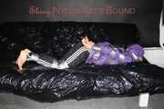 Sexy Sandra tied and gagged with tape and a cloth gag on a sofa wearing sexy downwear (Pics)