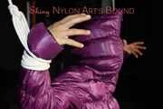 Sandra tied, gagged and hooded complete overhead with ropes and a clothgag wearing a sexy purple down jacket and a rain pant (Pics)