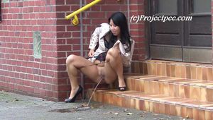 068016 Naughty Ling Takes A Long Arcing Pee From The Office Steps
