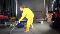 Watching sexy SANDRA vacuum cleaning the studio wearing a sexy yellow rainwear combination (Video)