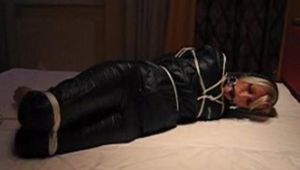 Beautiful archive girl tied, gagged and hooded in several situations wearing shiny nylon rainwear (Video)