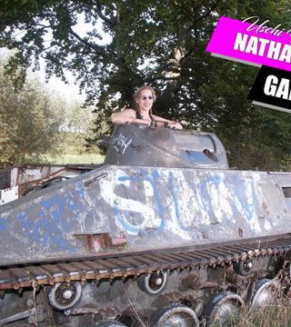 Nathalie poses on a Hotchkiss armored personnel carrier