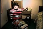 25 Yr OLD 2nd GRADE SCHOOL TEACHER IS MUMMY WRAPPED AND GAGGED WITH PLASTIC WRAP, BLACK ELECTRICAL TAPE AND SILVER DUCT TAPE ON A CHAIR (D68-13)