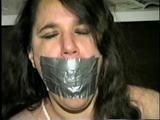 34 Yr OLD LATINA HOUSEKEEPER WITH BIG TITS IS BEING HELD HOSTAGE & IS MOUTH STUFFED WITH SPONGE & RAG, TIED TO A CHAIR, CROTCH ROPED WHILE WEARING BLACK LACE TEDDY (D57-4)